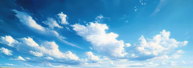 Fluffy white clouds drift across a bright blue tropical sky above a distant horizon.