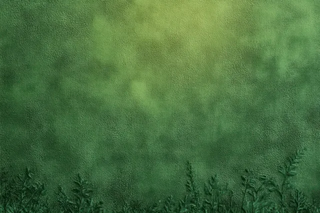 Close-up of green textured wall with small plant silhouettes along the bottom edge