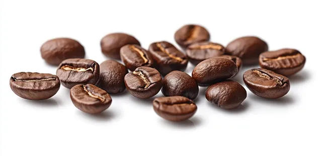 Roasted coffee beans with glossy surfaces scattered on a clean white background.