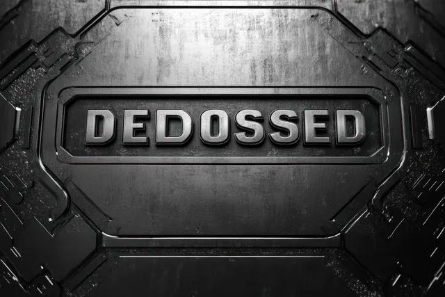 An embossed metal plate reading DEDOSSED on a dark textured surface.