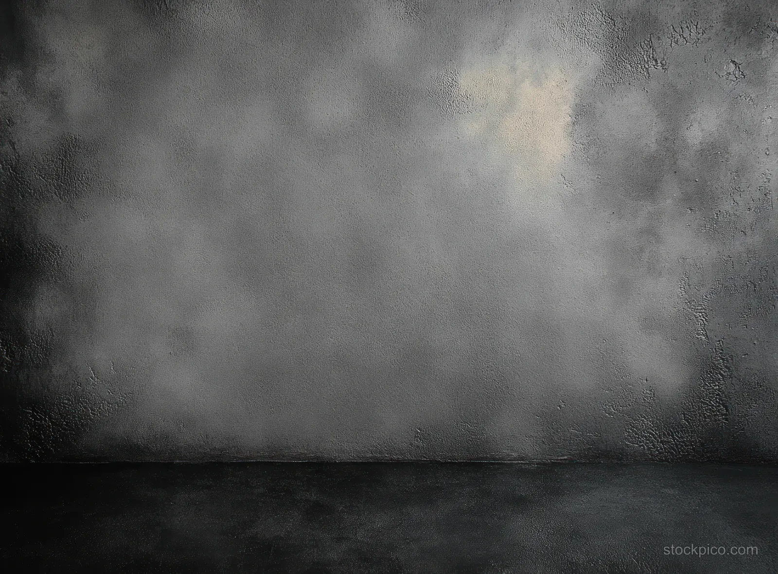 Empty dark concrete wall and floor with rough grunge texture and soft shadowed lighting.