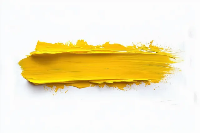 Thick yellow paint stroke across a white background with visible brush bristles and textured paint layers.