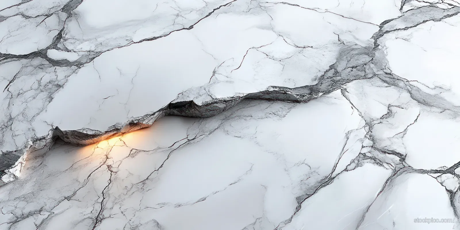 White marble surface with gray veins and a glowing crack across the center.