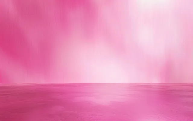 A calm pink ocean reflects a bright sky with soft gradient clouds and an open serene horizon.