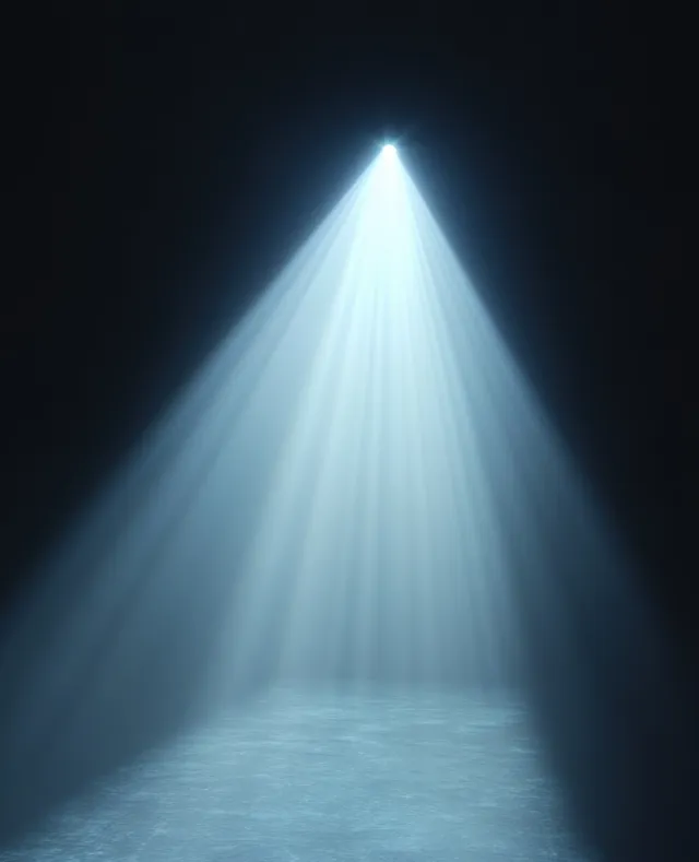 White spotlight beam cuts through dark haze, illuminating a misty floor with strong rays