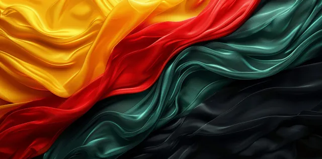 Flowing black, red, yellow, and green freedom flag fabric with rich textile folds