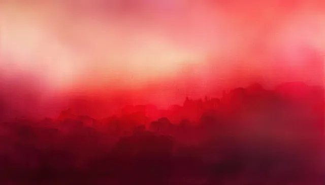 Crimson and pink blurred gradient background with a dark citylike silhouette fading into warm haze.