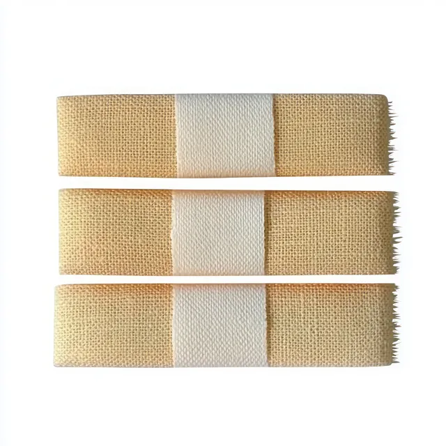 Three light beige fabric adhesive bandages with white central pads arranged horizontally on a white background.