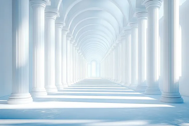 Sunlit symmetrical corridor with white classical columns and arched ceiling casting long shadows.