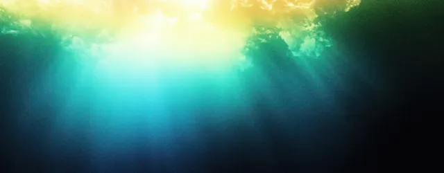 Dark blue and vibrant green glow forms a smooth abstract gradient background with a bright light bloom.