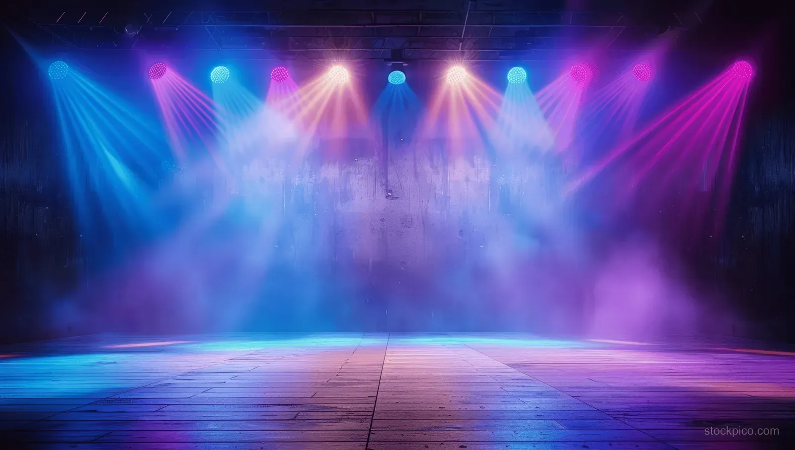 Empty concert stage with blue and purple spotlights, smoky atmosphere, and a wooden floor, perfect for event backgrounds.