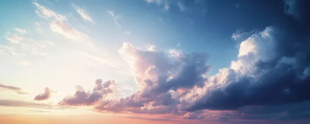 Impressionist sunset sky with layered clouds glowing in pastel gold and ultramarine