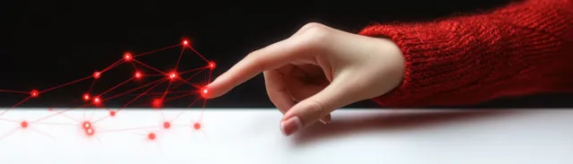 A hand in a red sweater sleeve touches glowing red network nodes on a dark tech background.