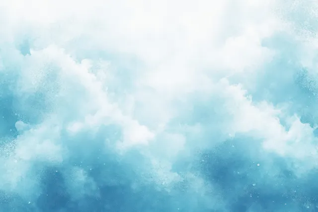 Blue sky background with fluffy white clouds and soft dreamy haze.