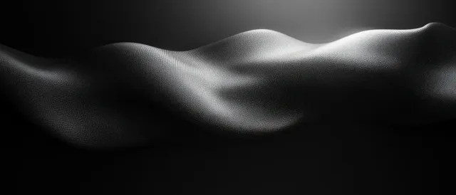 Abstract black gray gradient background with soft blurred light streaks and subtle grain texture.