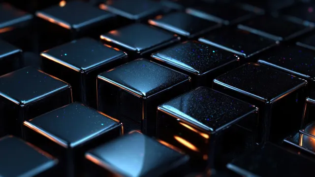 Close-up grid of glossy black cubes with warm highlights and subtle sparkle texture