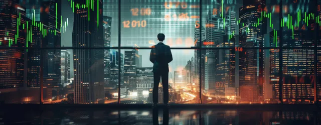 A businessman views glowing stock market graphs while skyscrapers light up the night city behind him.