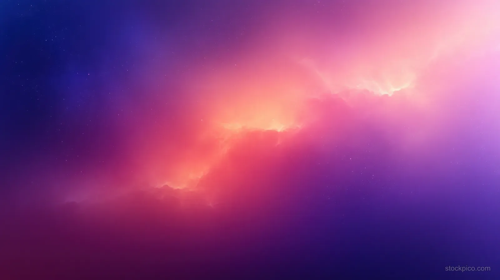 An orange and purple nebula glows across a dark starfield with soft interstellar haze.