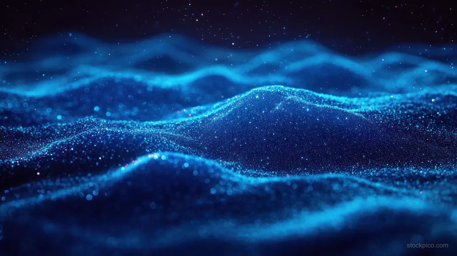 Blue glowing particle waves ripple across a dark starry background with luminous streaks and sparkling texture.