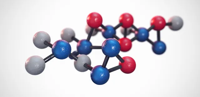 Close-up molecular model with blue red gray spheres and black bonds on white background