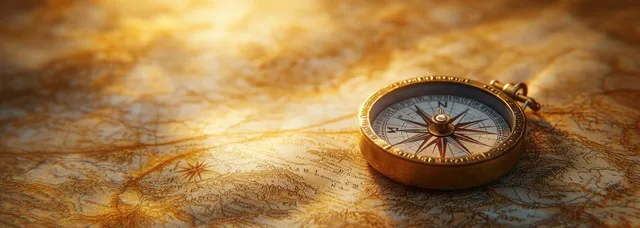 Antique compass resting on an aged world map with engraved routes and latitude lines