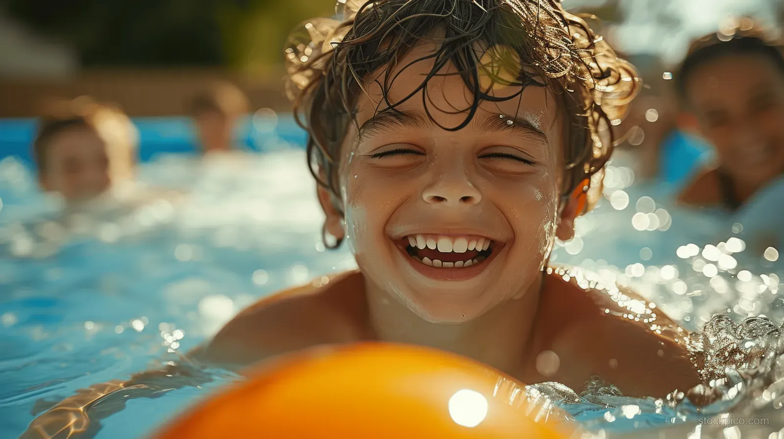 A laughing child splashes water while playing in an inflatable pool, with sunny highlights and blurred friends behind.