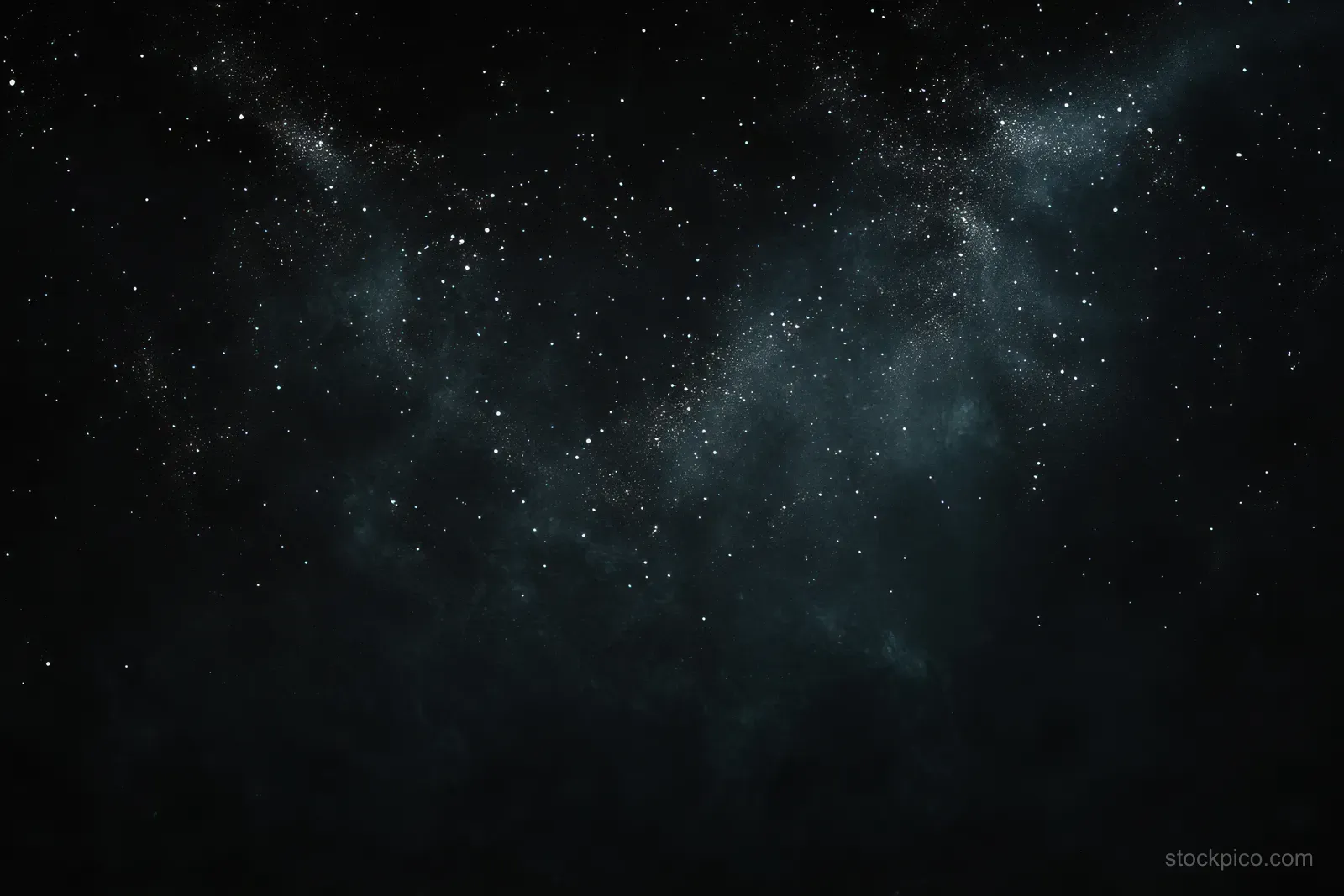 Twinkling stars spread across a dark night sky with faint cosmic dust clouds and subtle nebula haze.