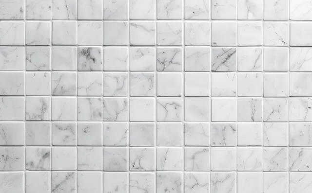 White marble mosaic tile wall pattern with subtle gray veining and grout grid