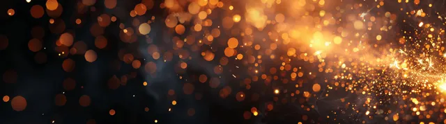 Golden sparklers and glowing fireworks embers with bokeh lights scatter across a black background.