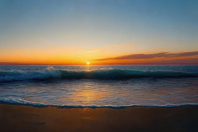 Sunset over sandy beach with gentle wave lines and glowing orange horizon