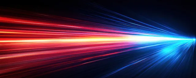 Blue and red light trails streak into a vanishing point in night space
