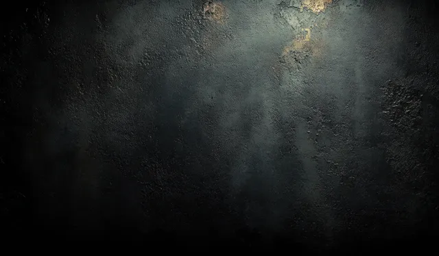Dark concrete wall surface with grunge texture, stains, and soft shadows under ambient light.