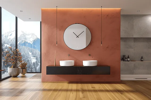 Minimalist bathroom showing a pink double-sink vanity and round mirror beside terrazzo tiles with a snowy mountain window view.