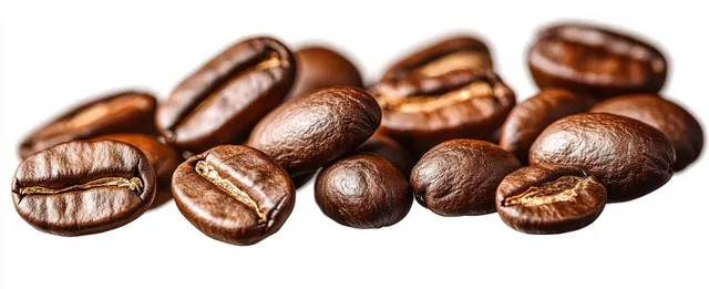 Close-up roasted coffee beans scattered on a white background with glossy texture