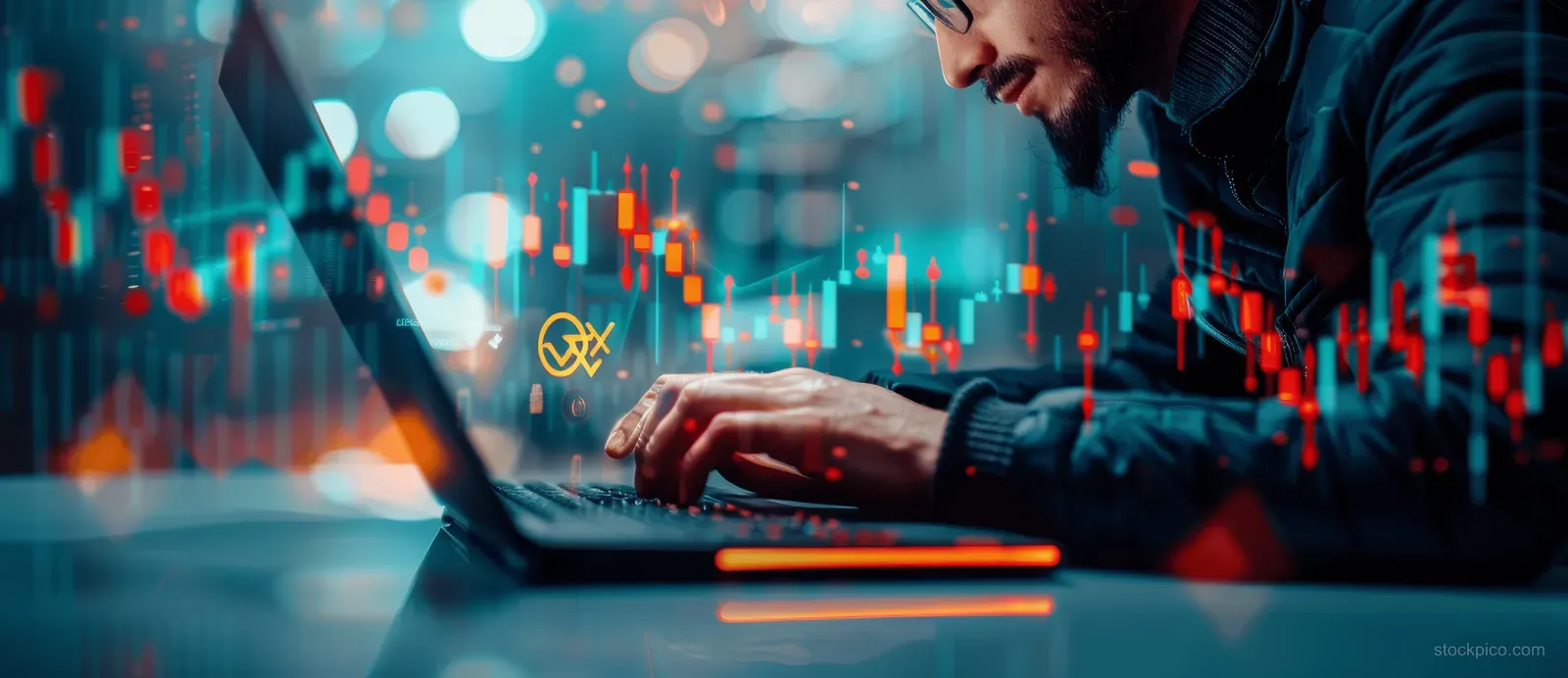 A person studies a laptop showing candlestick stock charts with glowing market indicators behind them.