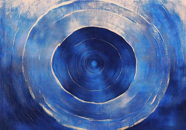 Textured blue concentric rings with metallic silver highlights forming a calm radial pattern
