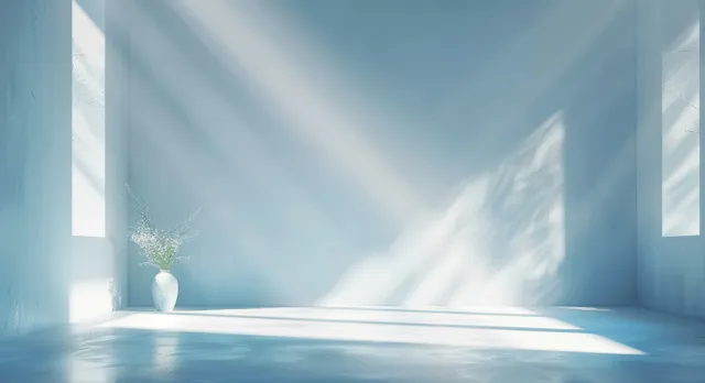 Soft light blue abstract studio background with gentle shadows and minimal interior depth