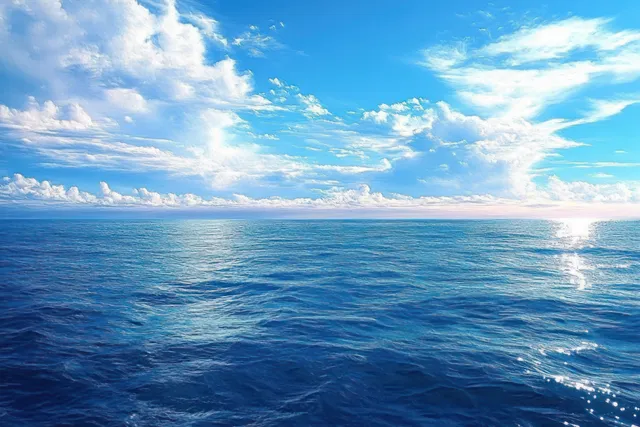 Vibrant ocean seascape with shimmering horizon light beneath scattered blue clouds