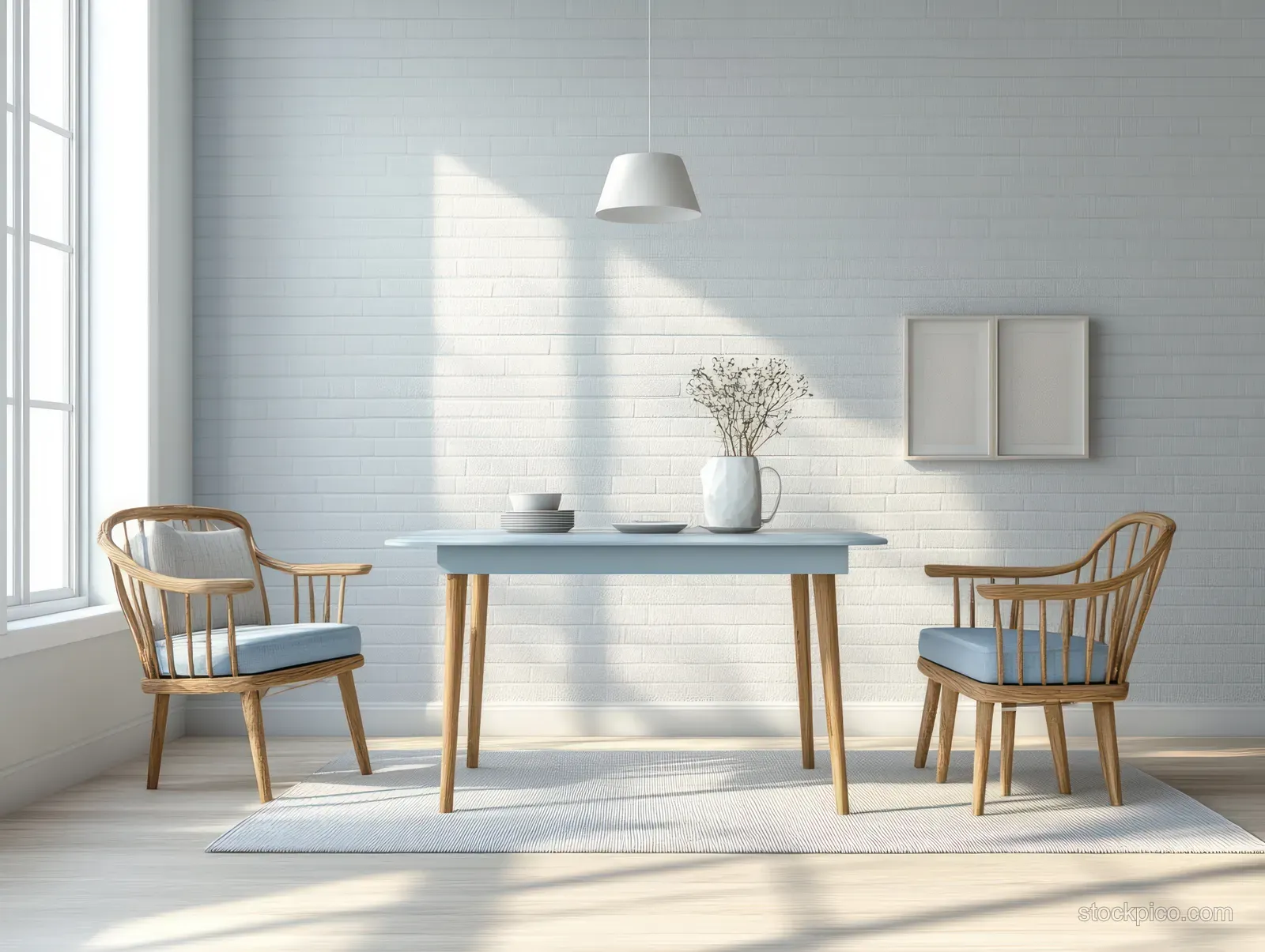 Sunlit dining nook with a pale blue table, two wooden chairs, and minimal blue-white decor against brick walls.