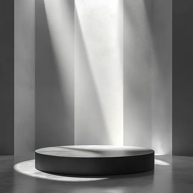 A dark round pedestal centered in a minimalist room as soft light beams illuminate tall walls.