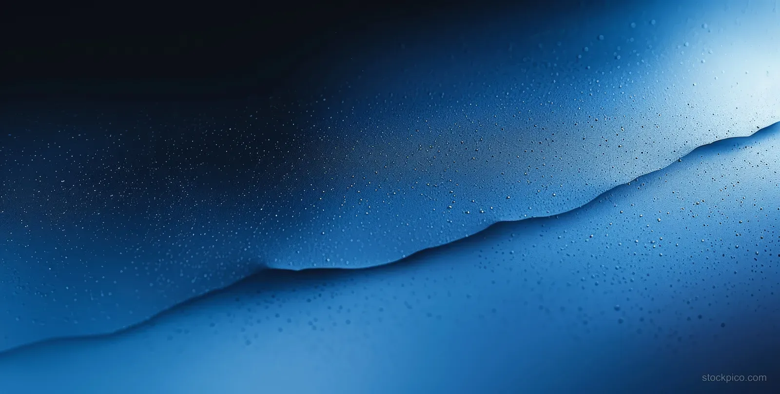 Blue and white gradient background with grainy texture and dark cinematic lighting, leaving empty copy space.