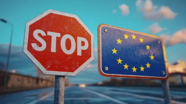 A weathered STOP sign and a blue road sign with yellow EU stars sit by a blurred roadway under partly cloudy skies.