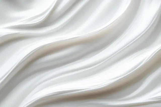 Creamy white swirled texture background with soft folds and subtle sheen