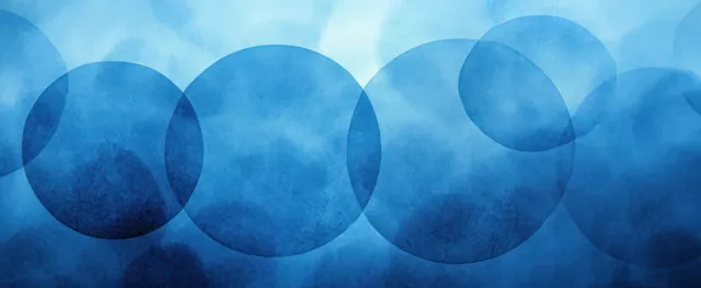 Layered blue circles overlap across a grunge textured background with faint white ring patterns.