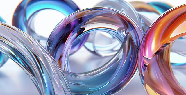 Close-up of iridescent 3D glass rings showcasing vivid refraction and sleek curves against a white background.