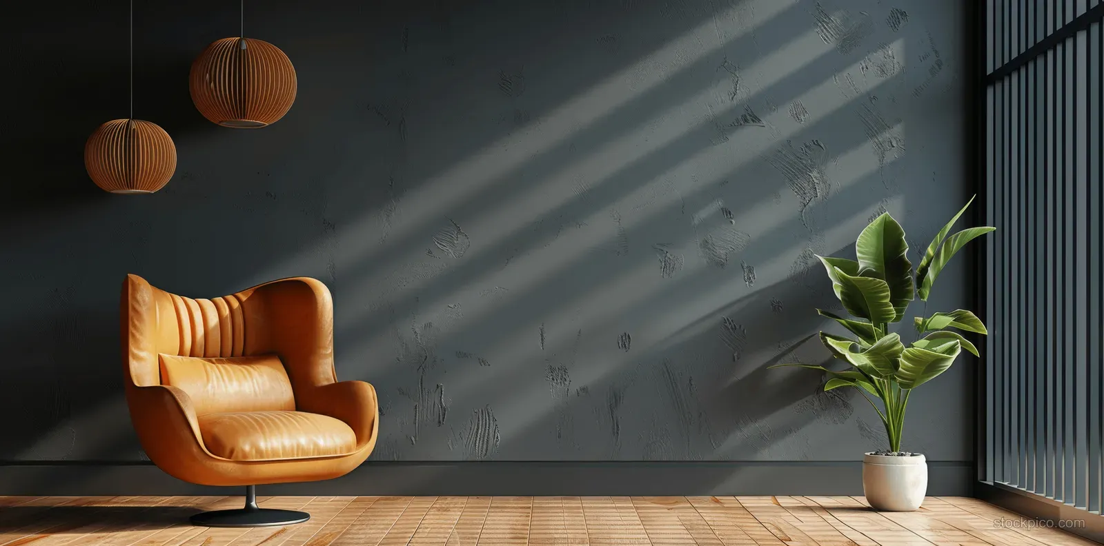 Leather armchair near a dark gray wall with a potted green plant on wood flooring and hanging lights shadows.