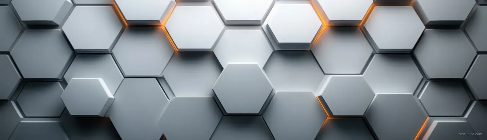 Gray and white 3D hexagonal tiles form a symmetric grid on a wall under soft diffuse lighting.
