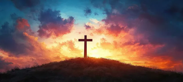 A silhouette cross rises on a hill under vivid sunset clouds and a glowing horizon.