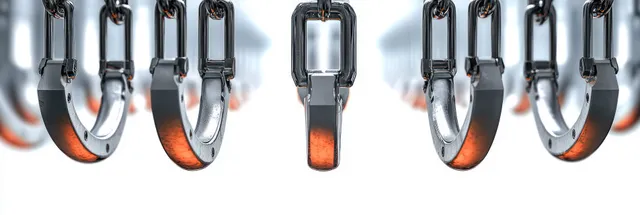Close-up of shiny steel handcuffs hanging in rows with orange reflections on white background