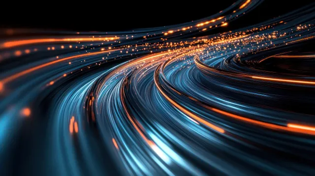 Una autopista en túnel oscuro muestra estelas de luz azules y cobrizas curvándose con un intenso desenfoque de movimiento.